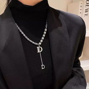 Diamond dangling D necklace. Brand new